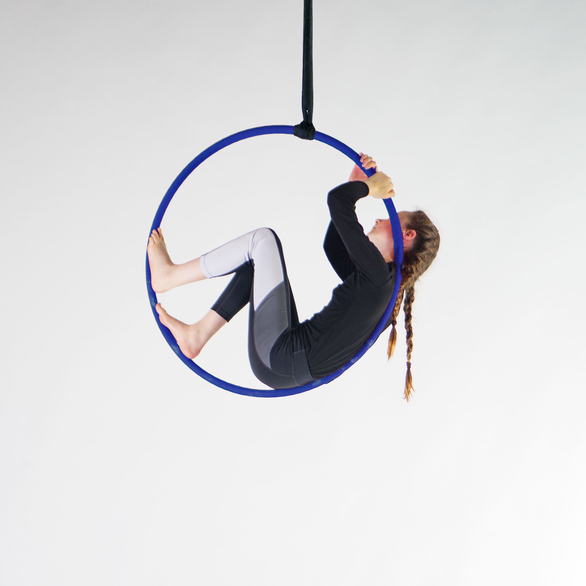 Action shot of youth performer in hoop