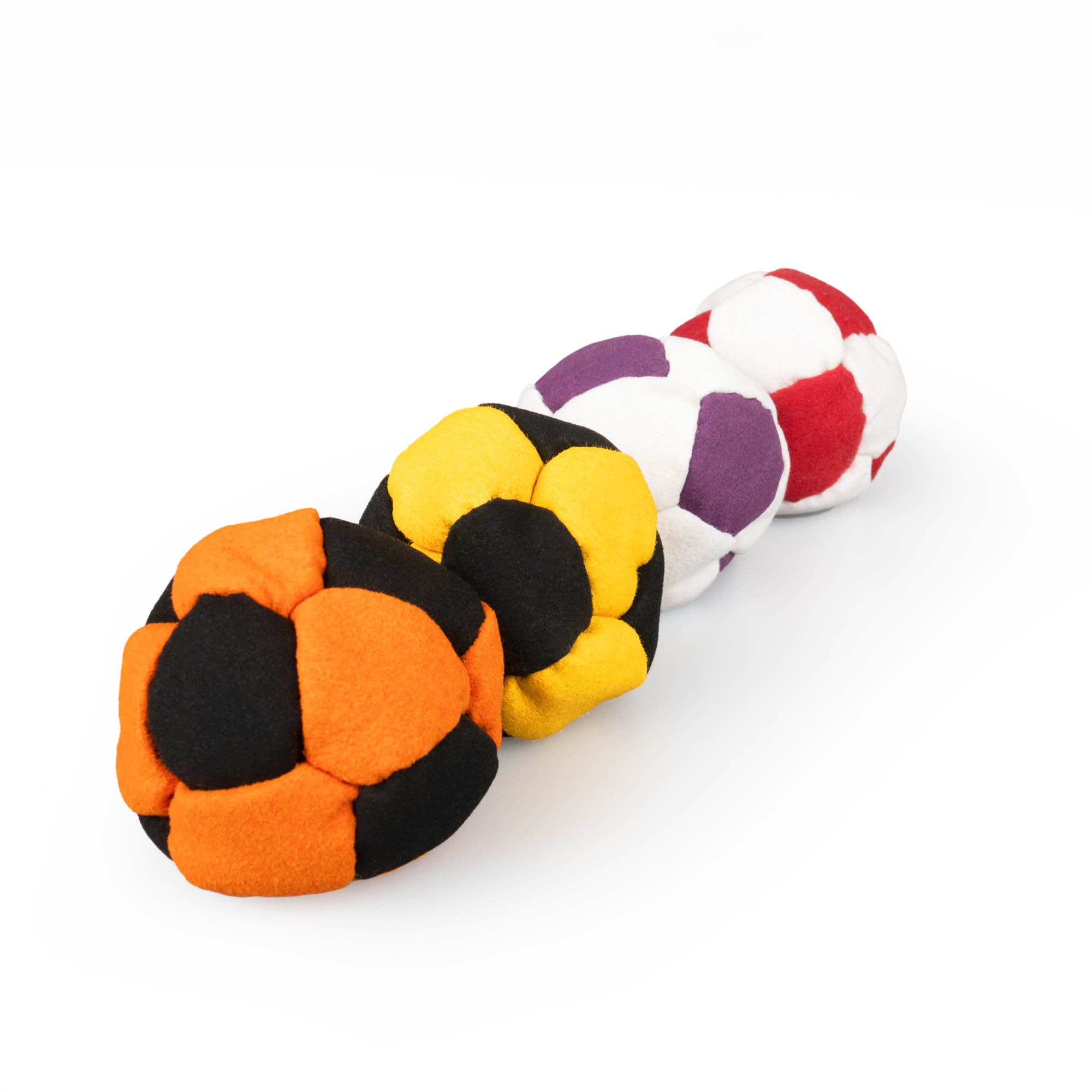 All four colour variant firetoys hacky sacks in line