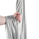 Silver yoga hammock wrapped around hand