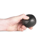 Firetoys black 110g thud juggling ball being squeezed