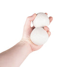 Firetoys two white 110g thud juggling balls in hand