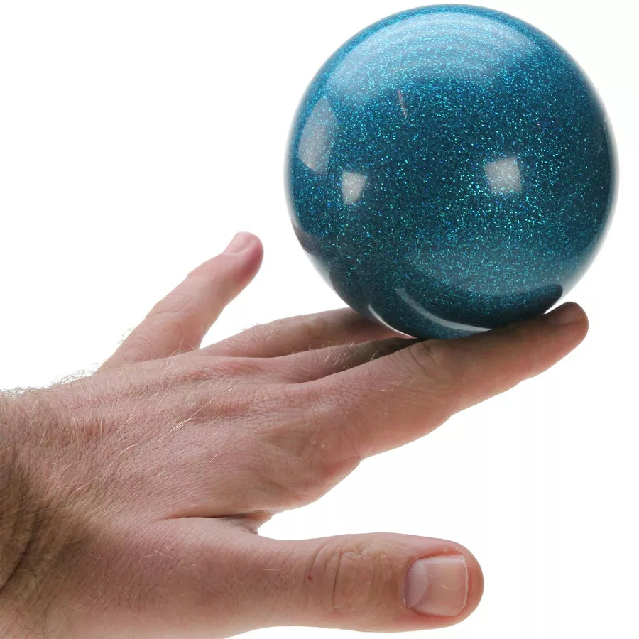 Blue glitter ball on hand
