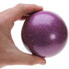 A hand holding a 100mm purple glitter stage ball