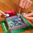 Hands holding tokens from game