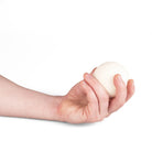 Single white Mr Babache russian juggling ball in hand