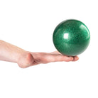 Green glitter ball on green background