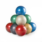 Colorful glittery balls stacked on a white background