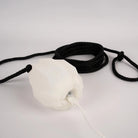 White dart with black rope on a white background