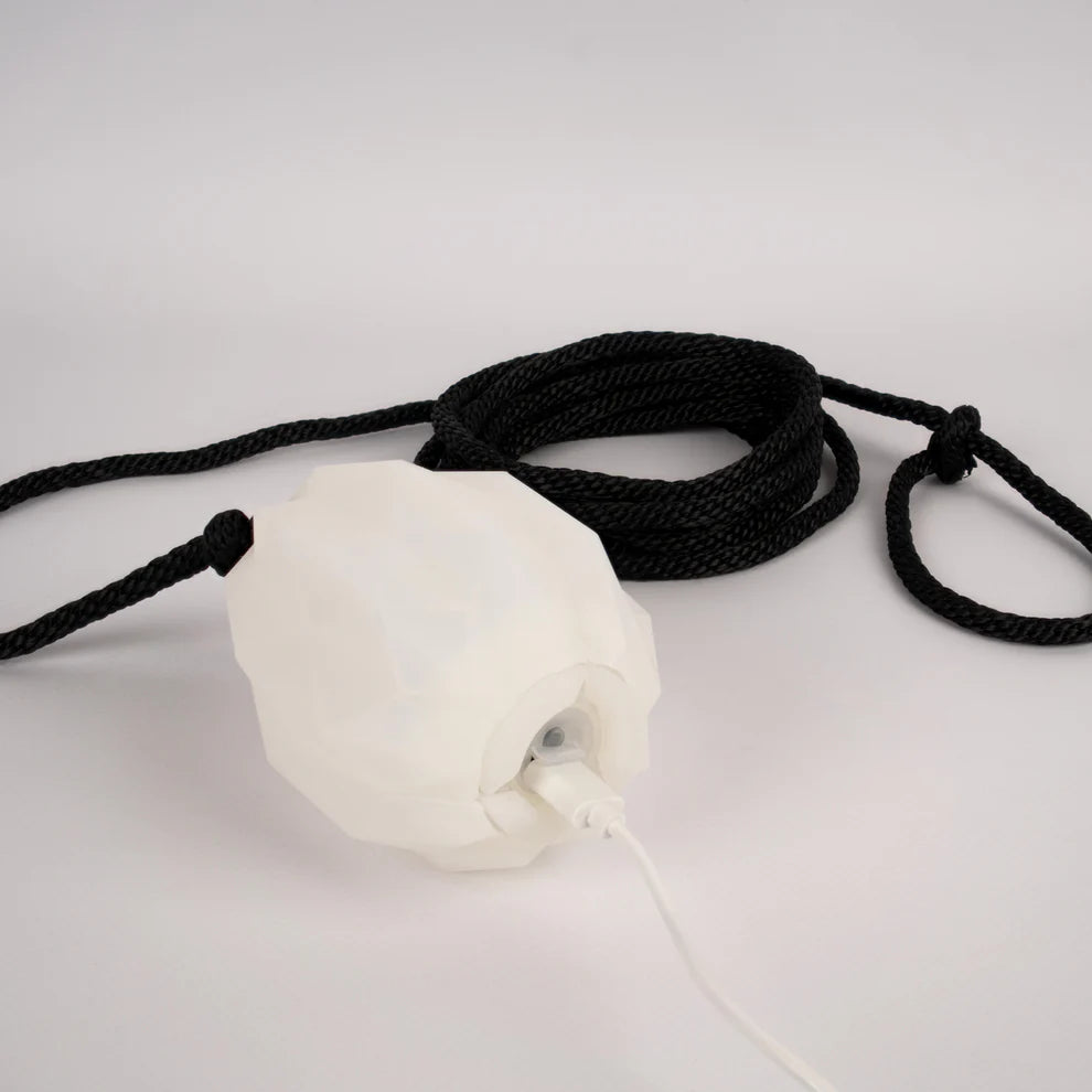 White dart with black rope on a white background