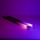 Two glowing ends against a purple background