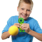 squeeze popper being squeezed and ball flying