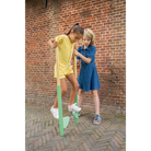 Children using wooden stilts