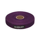 Purple roll of Newbaum's tape on a white background
