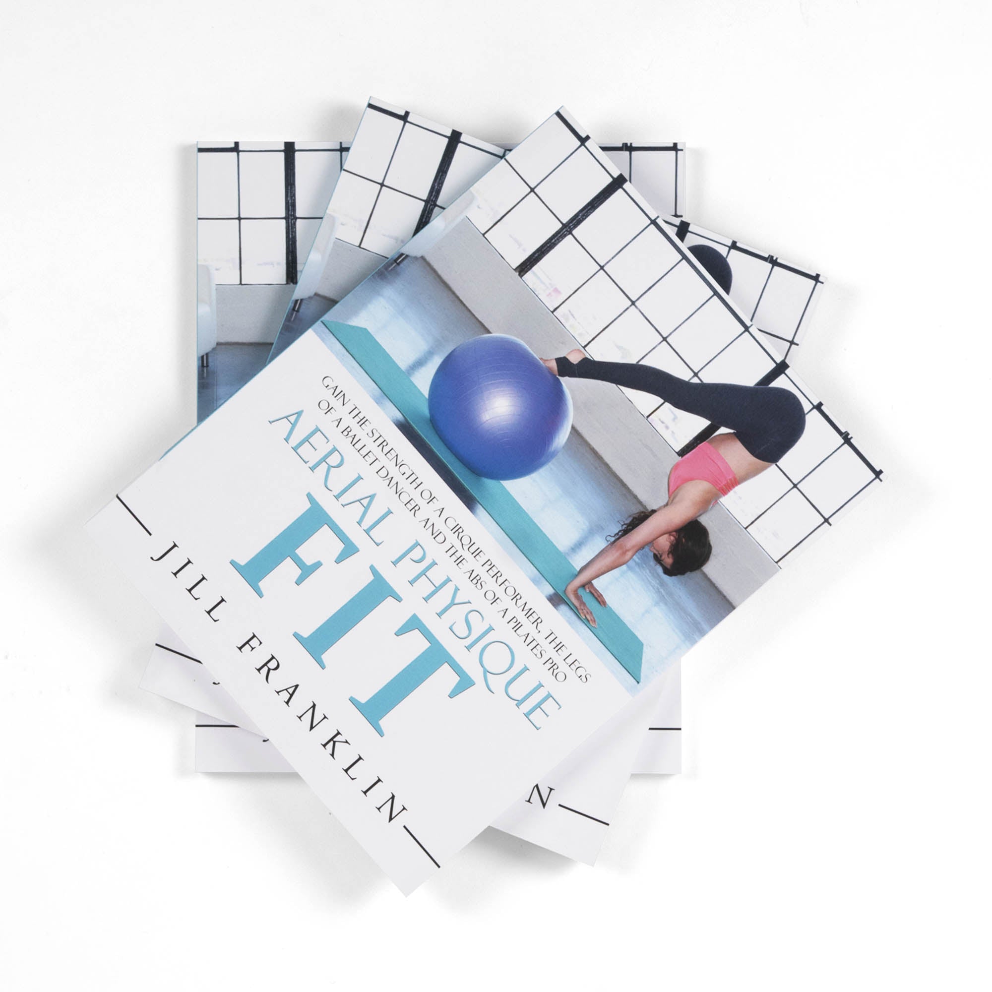 stack of Aerial Physique FIT books