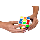 Quick cube being held by two hands on a white background