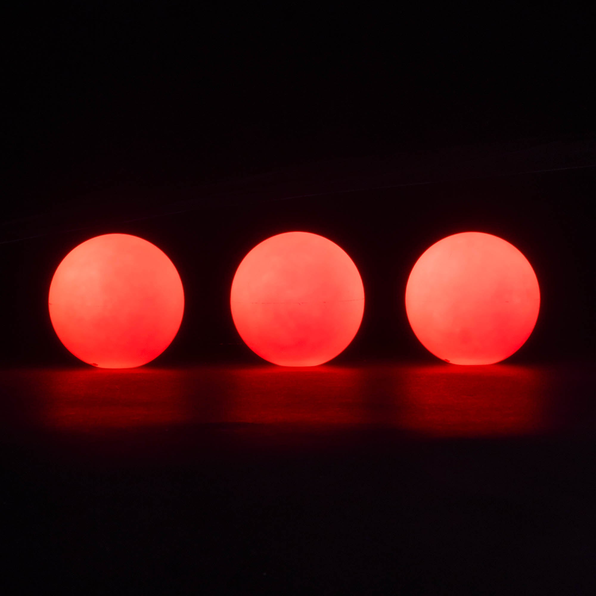 3 balls in a line glowing red