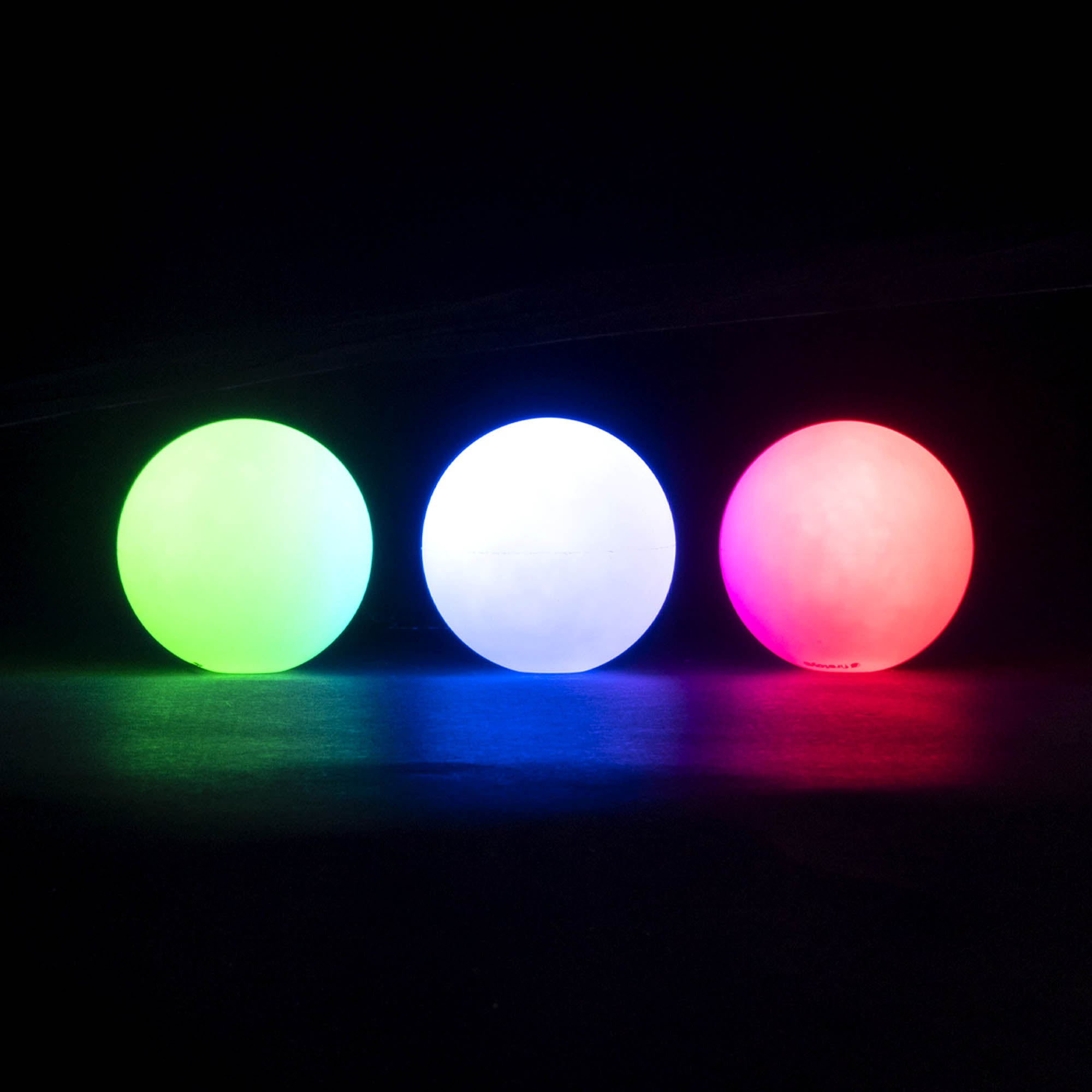 3 balls in a line glowing different colours