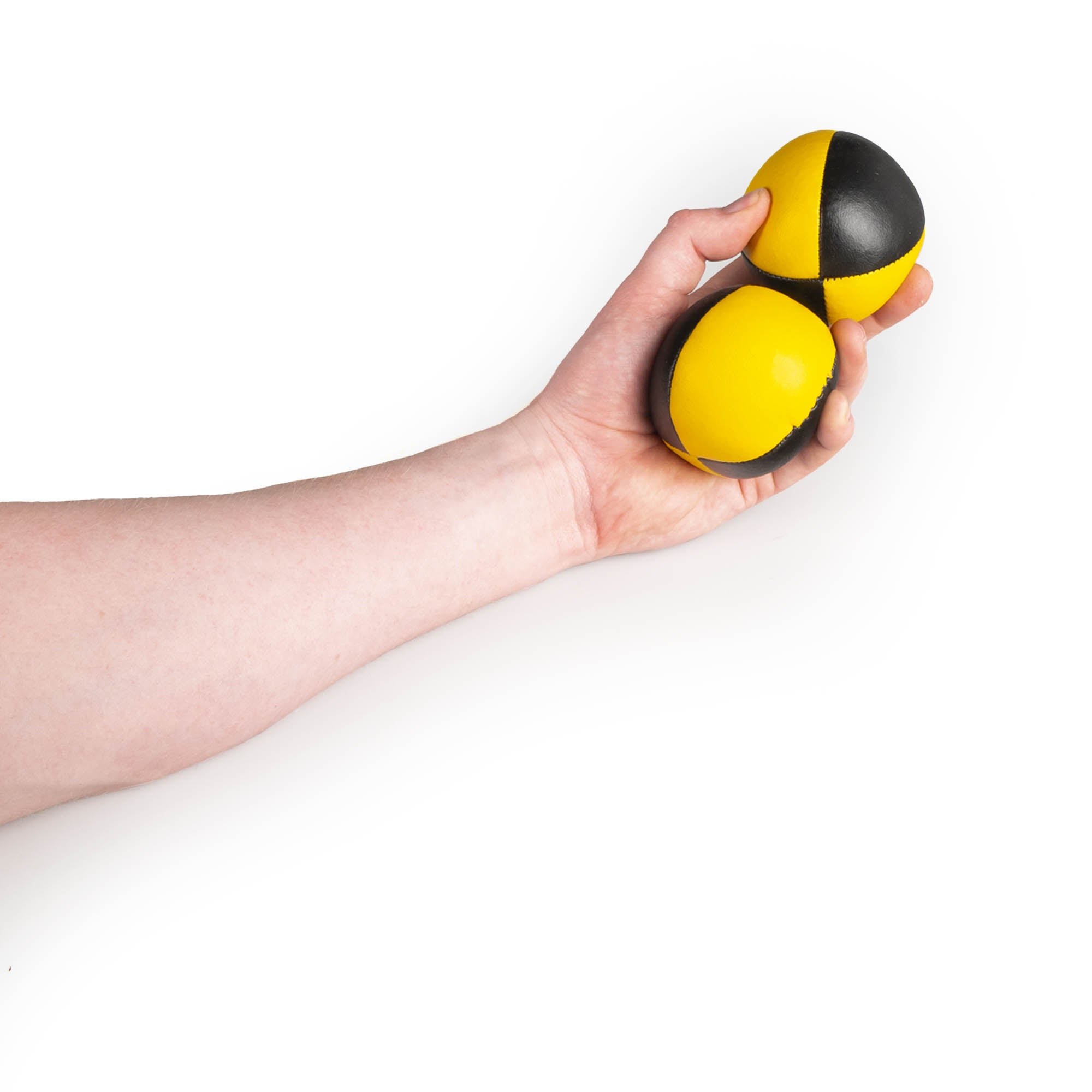 holding 2 black/yellow balls