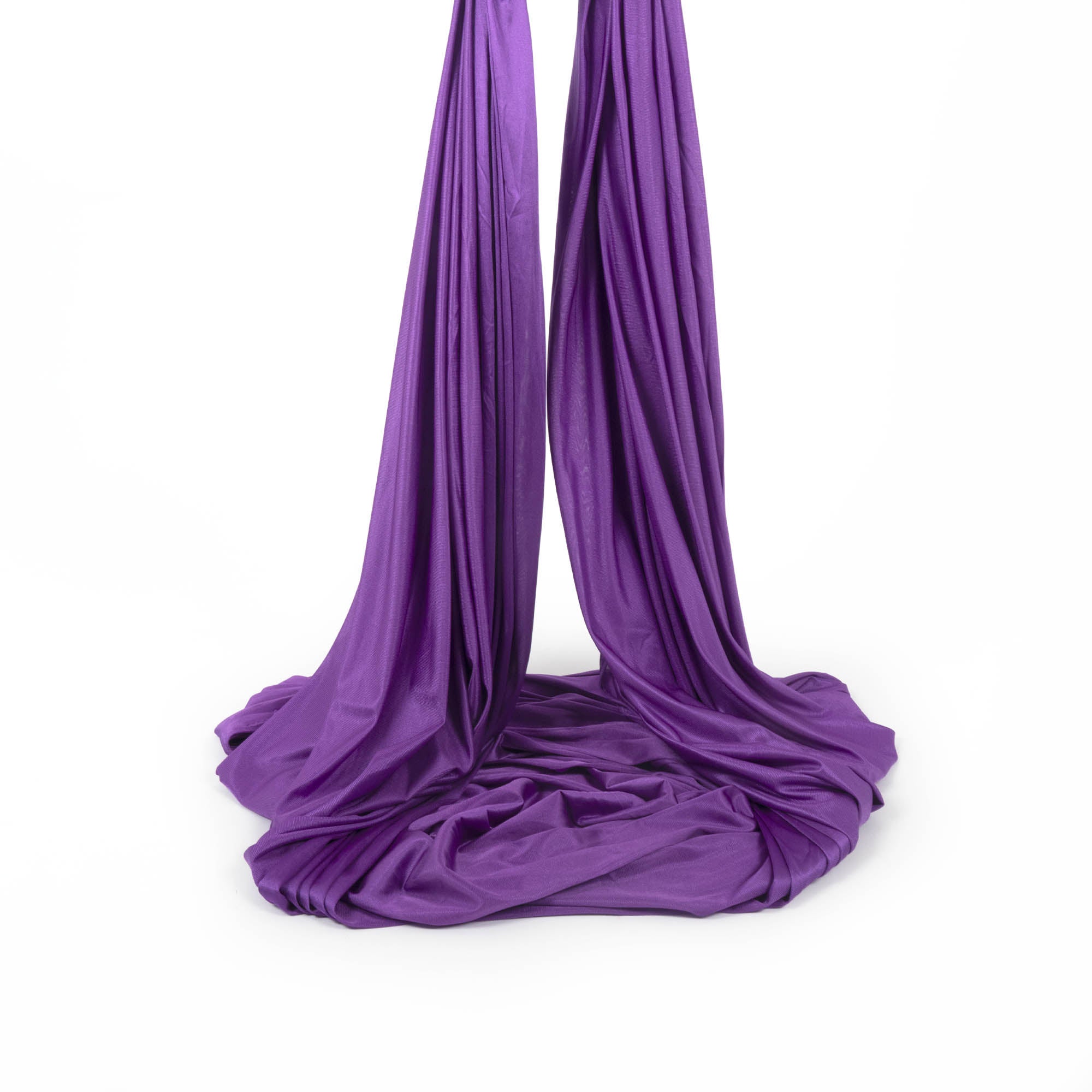 Purple yoga hammock piled up