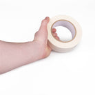 White tape in hand