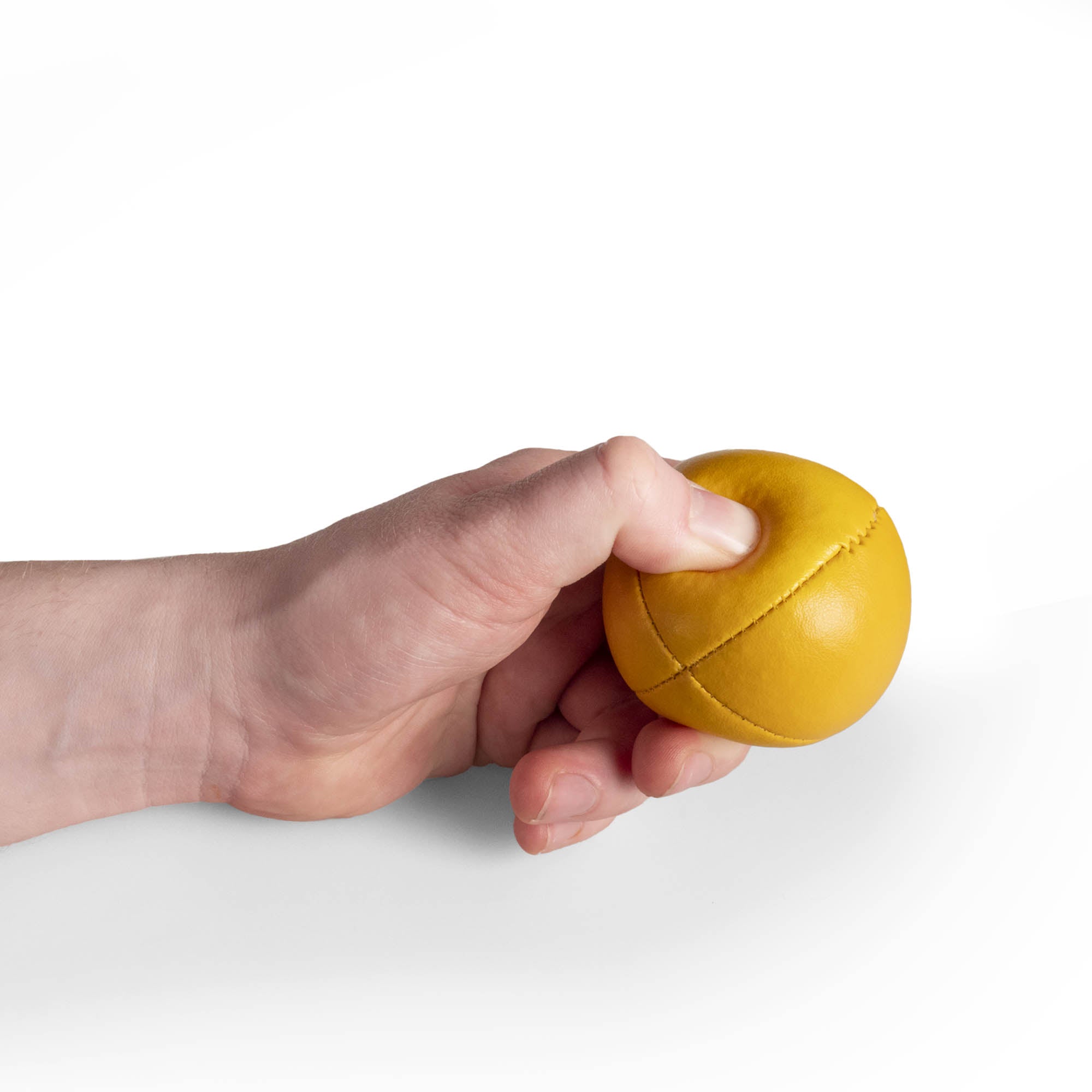 yellow ball in hand