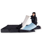 a person inserting foam layers