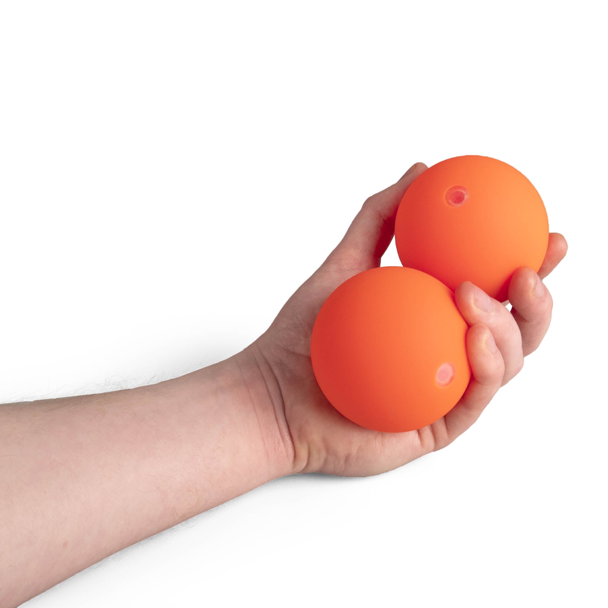 Two orange Mr Babache russian juggling balls in hand