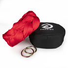 red sling with o-rings resting on hammock bag