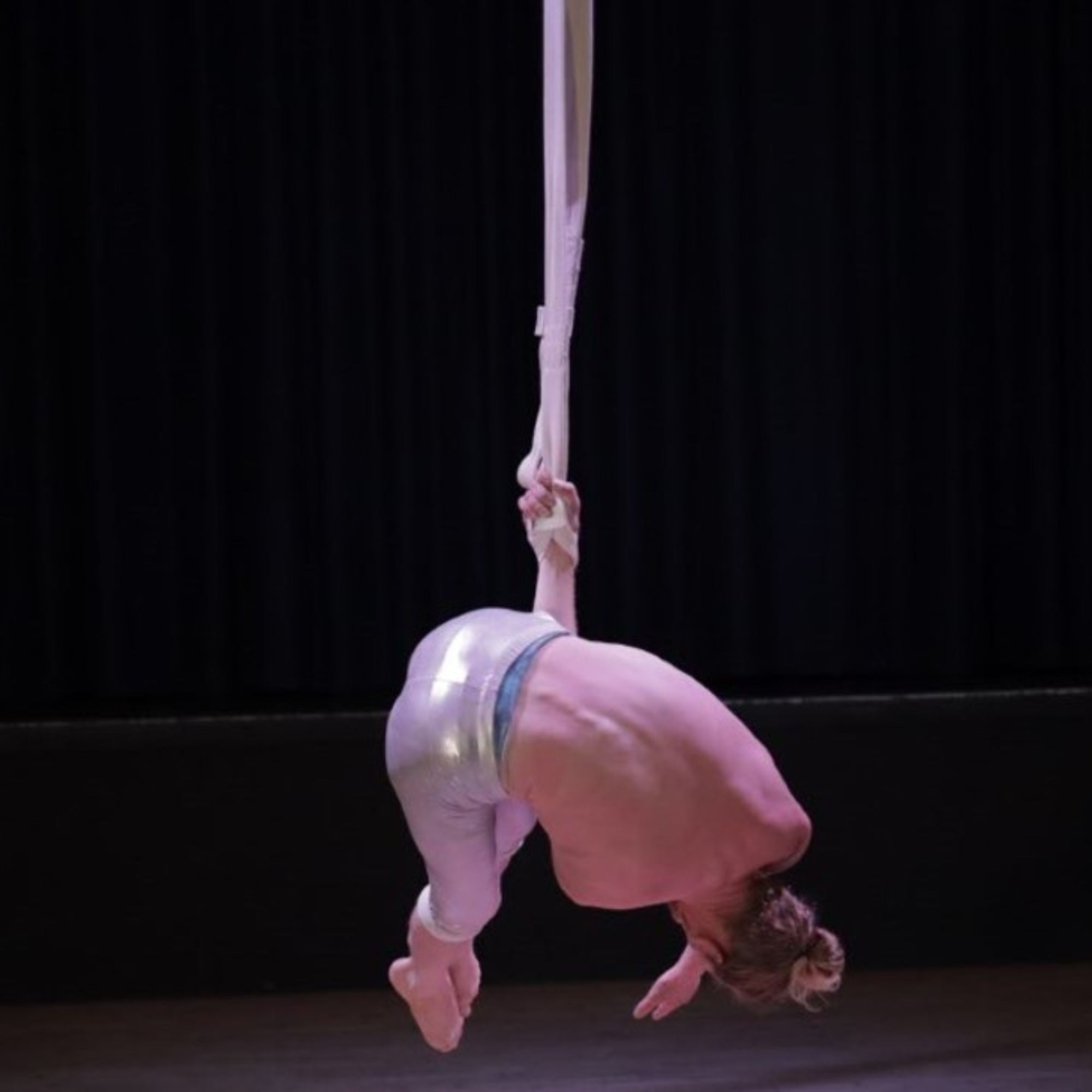 performer using cotton covered aerial straps