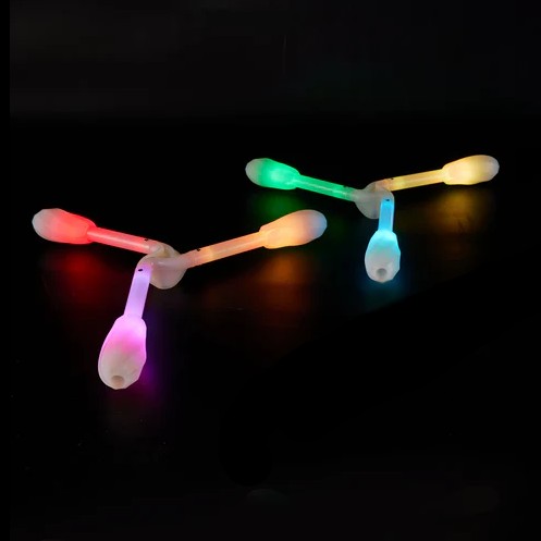 Colorful LED dragon ends on a black background