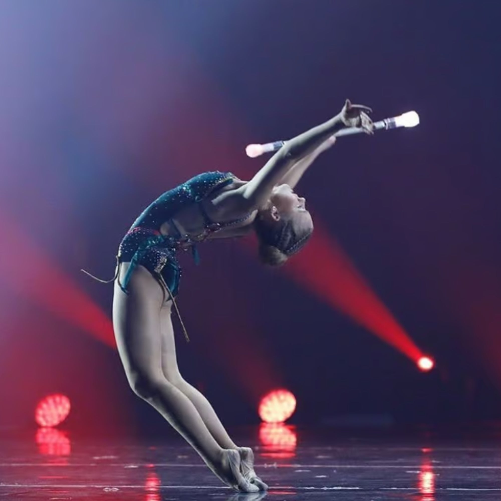 lady on a stage with baton