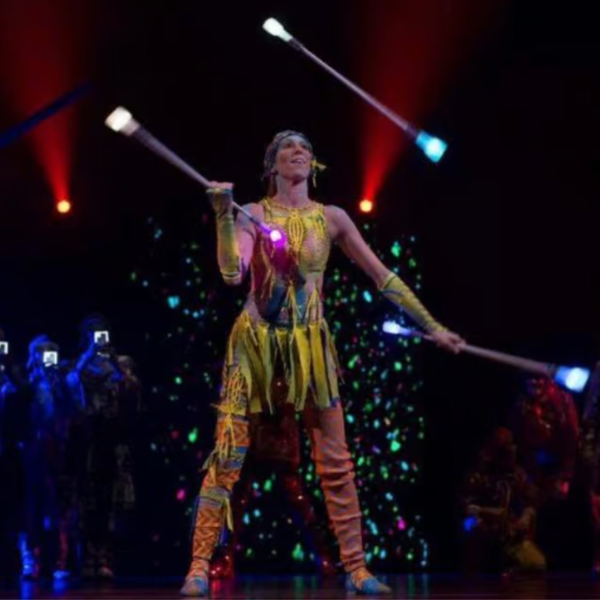 cirque du soleil performer juggling 3 batons