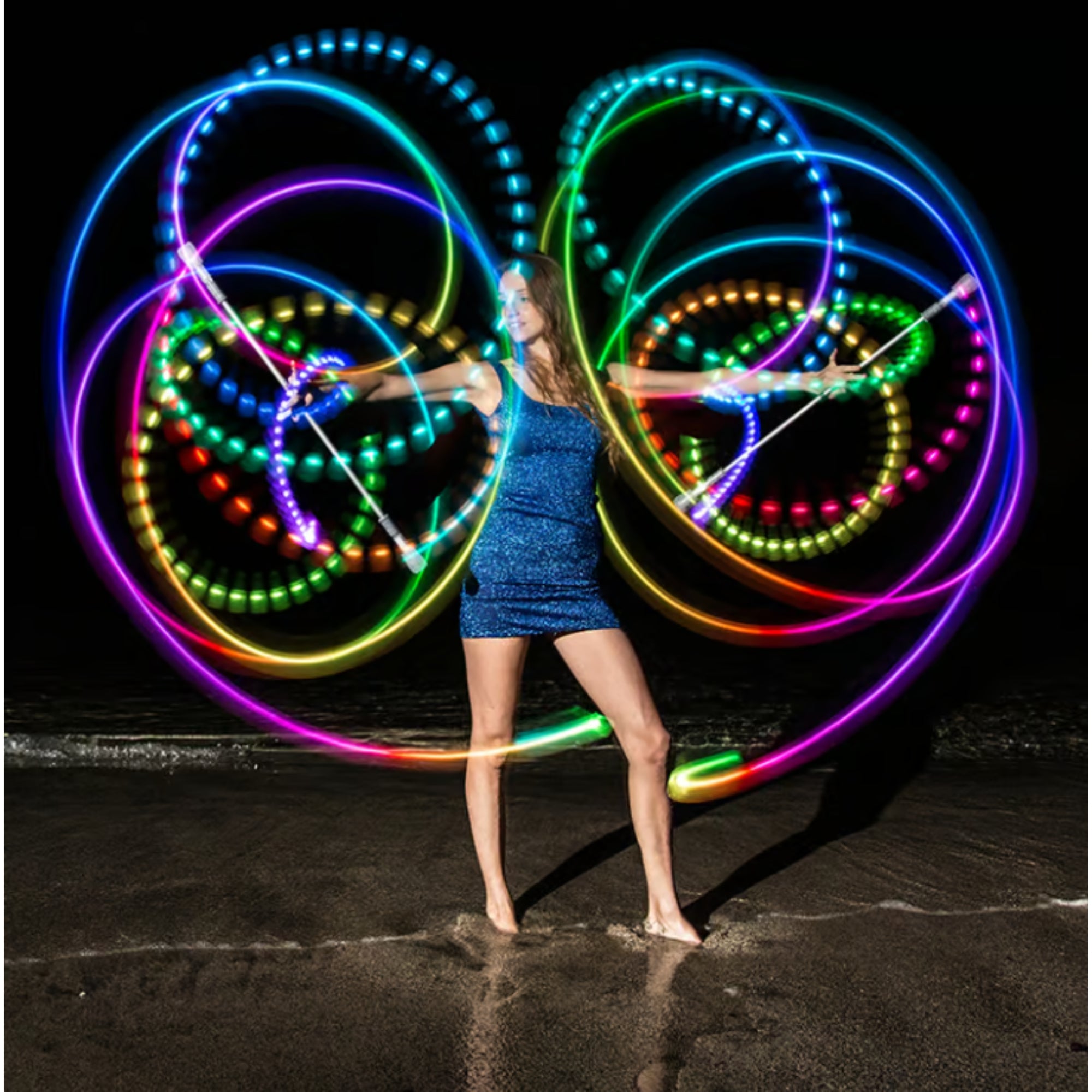 a person spinning 2 batons with light trails