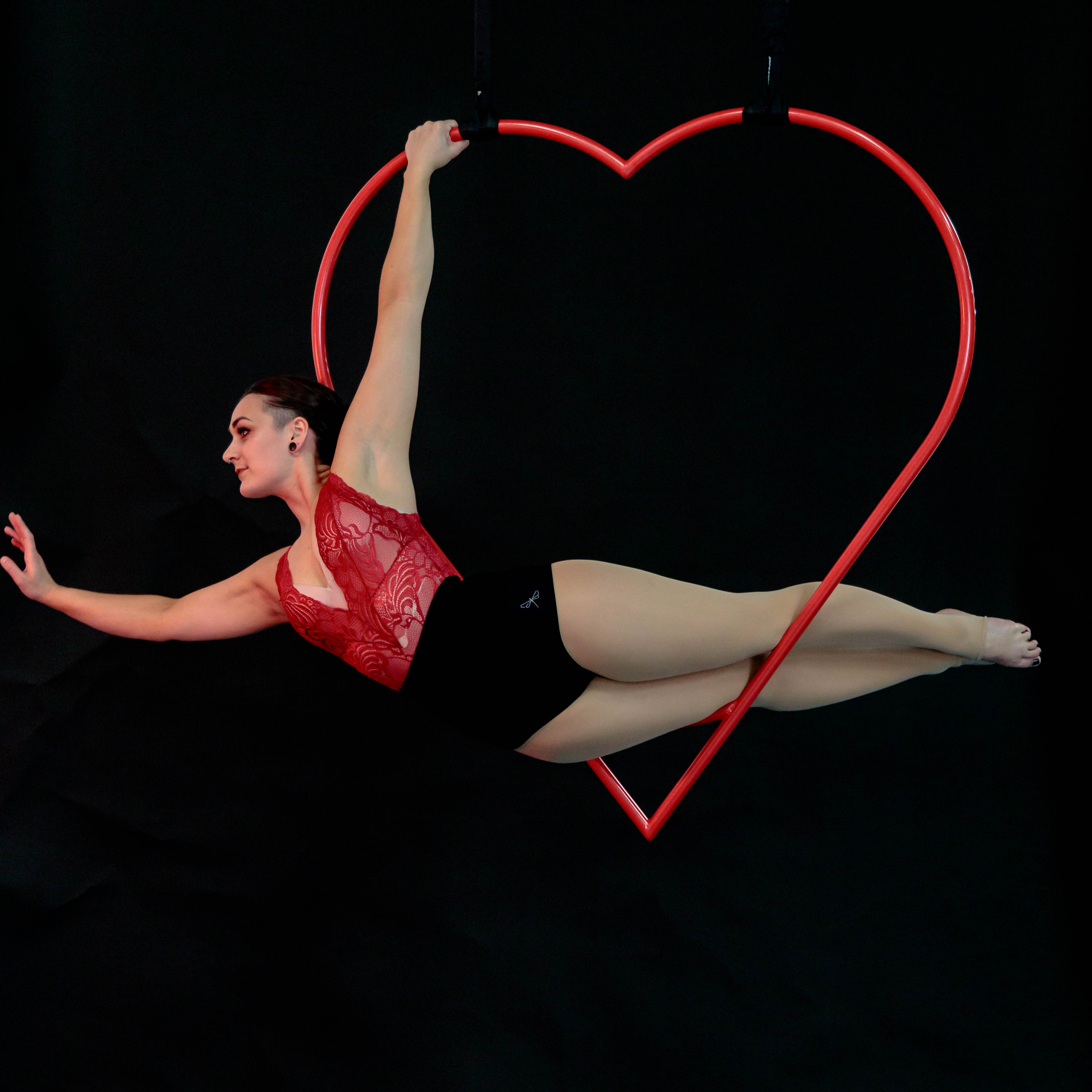 performance in an aerial heart hoop