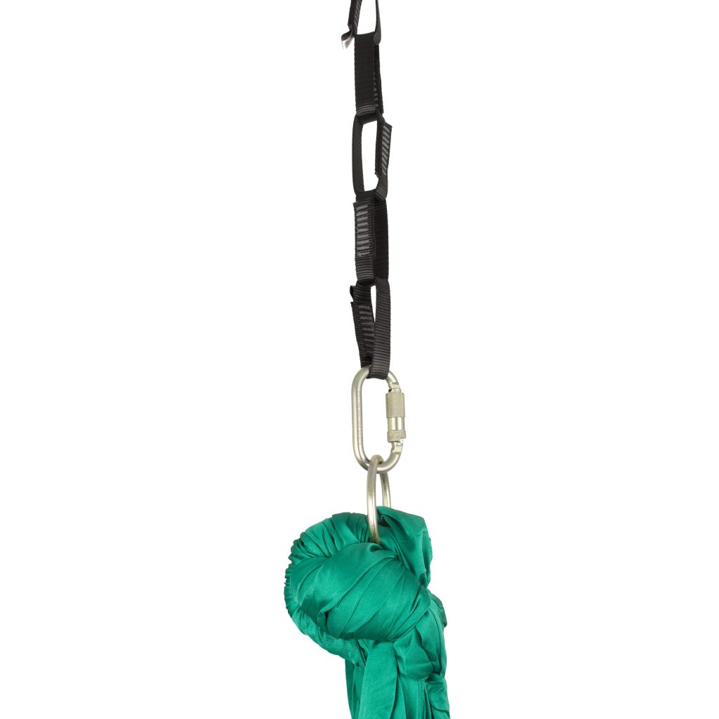 a green hammock tied onto O rings, clipped into a 5 loop chain as a rigging example